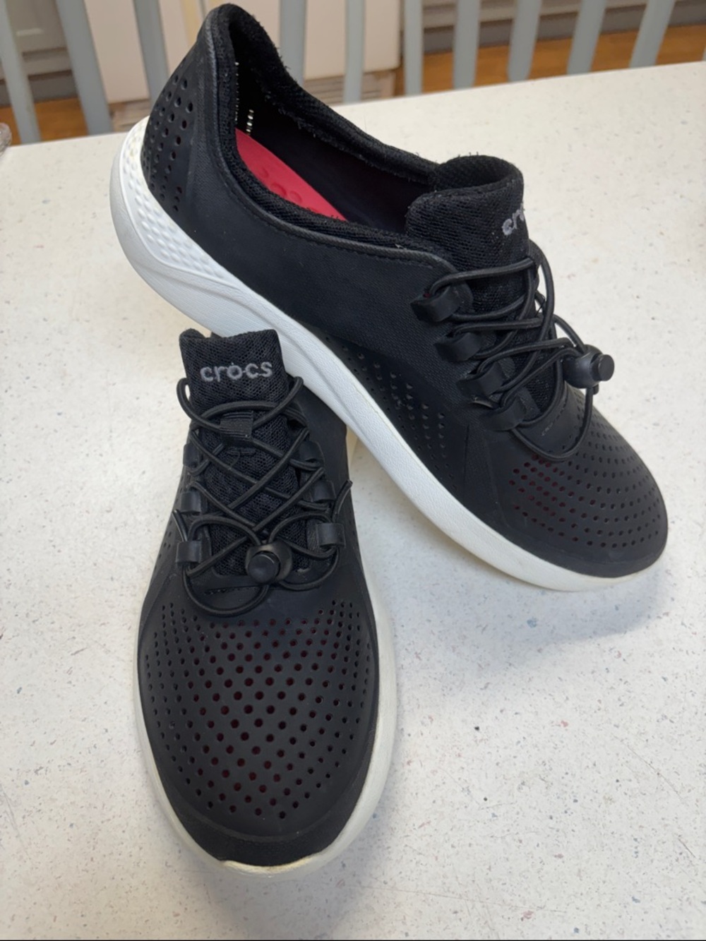 CROCS Black Slip-On Perforated Sneakers with White Soles and Red Insole